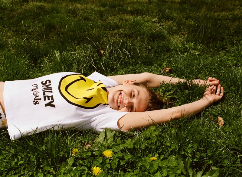 Looking happy, Cara Taylor poses in Zara  Smiley Happy Collection Shirt.