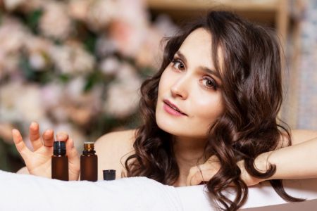 Why CBD Oil is So Popular Attractive Woman Oil Bottles Beauty
