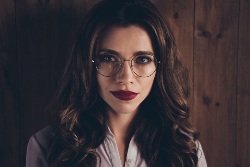 Beautiful woman Eyeglasses Red Lipstick Closeup
