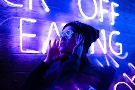 The Hype About Neon Signs Gen Z Young Woman Posing Front Red Neon Lights