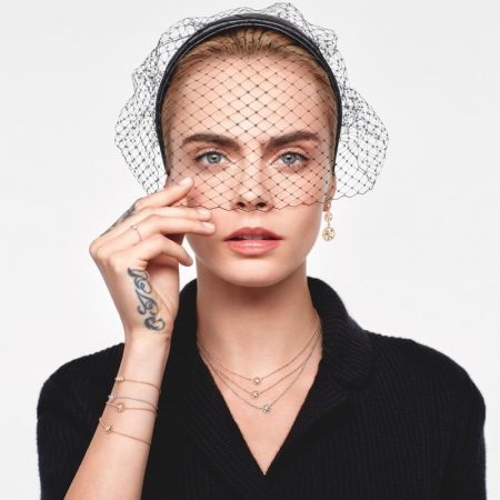 Wearing a veil, Cara Delevingne fronts Dior Rose Des Vents 2021 jewelry campaign.