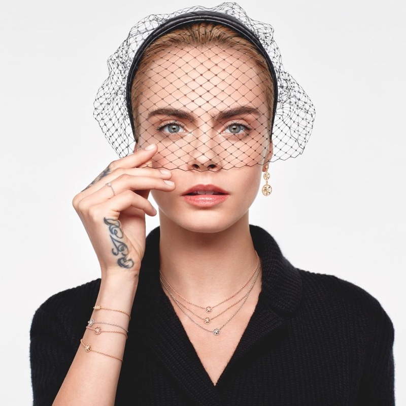 Wearing a veil, Cara Delevingne fronts Dior Rose Des Vents 2021 jewelry campaign.