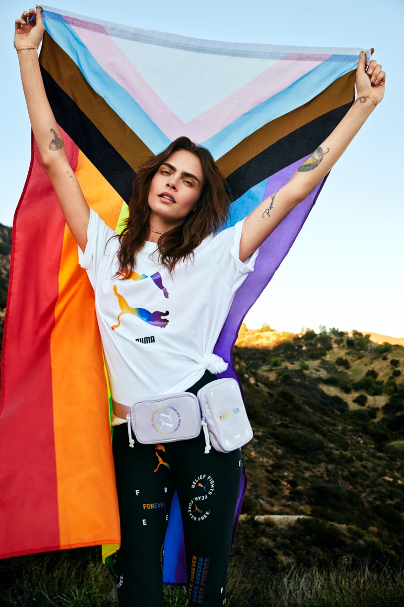 Posing with the LBTQIA+ flag, Cara Delevingne fronts PUMA Pride 2021 campaign.