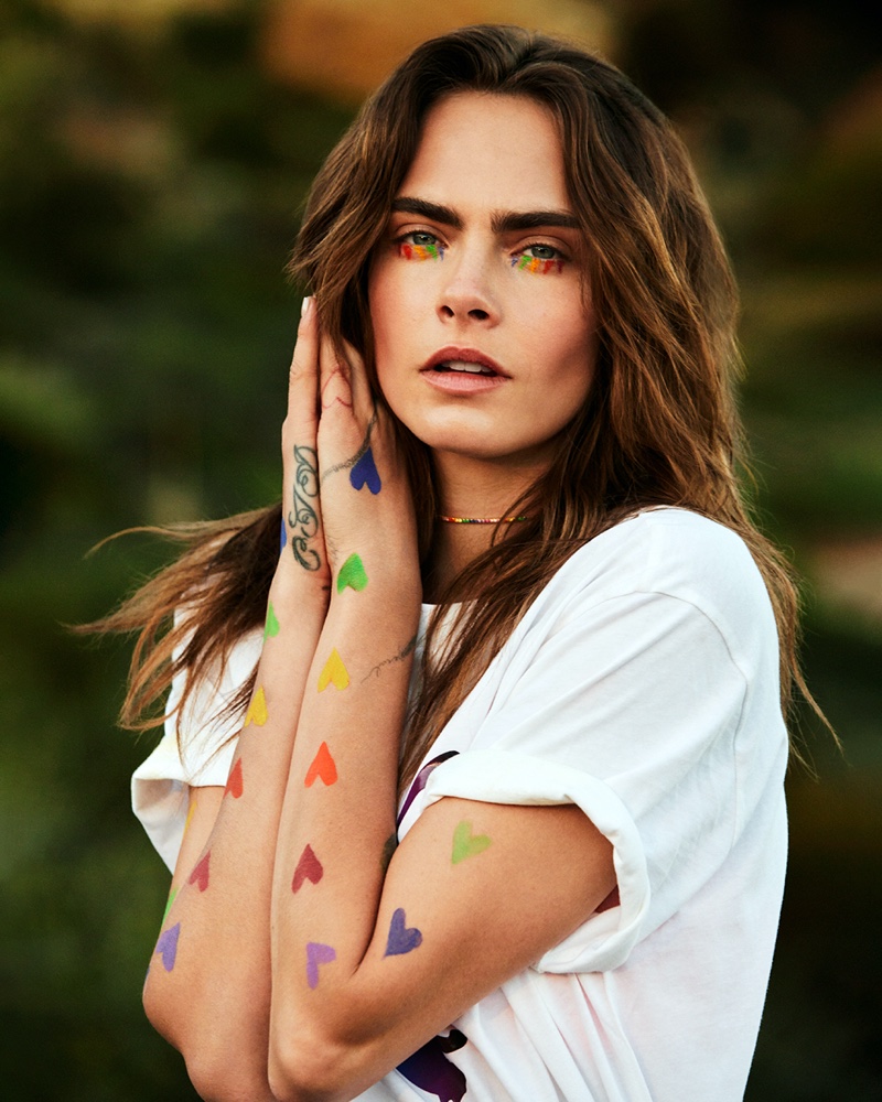 Cara Delevingne shows off rainbow heart accents for PUMA Pride 2021 campaign.