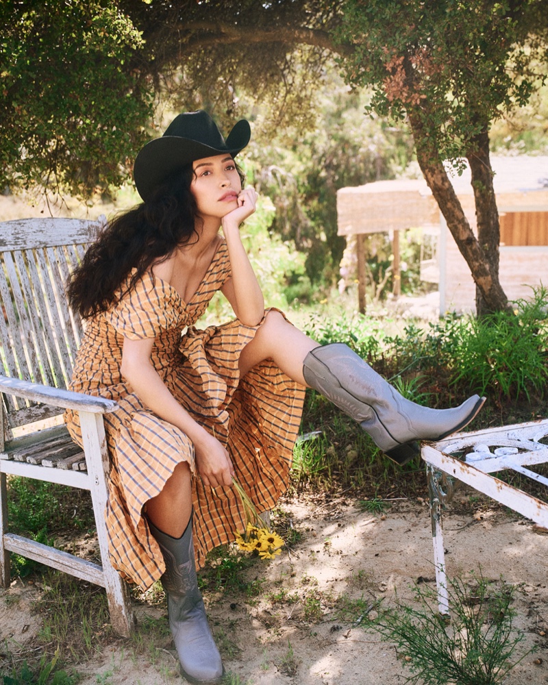 Christian Serratos wears Cinq à Sept dress and Montserrat Messeguer boots.