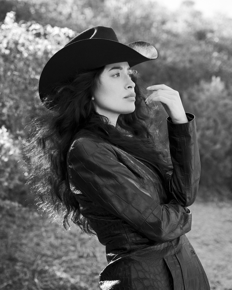 Photographed in black and white, Christian Serratos strikes a pose.