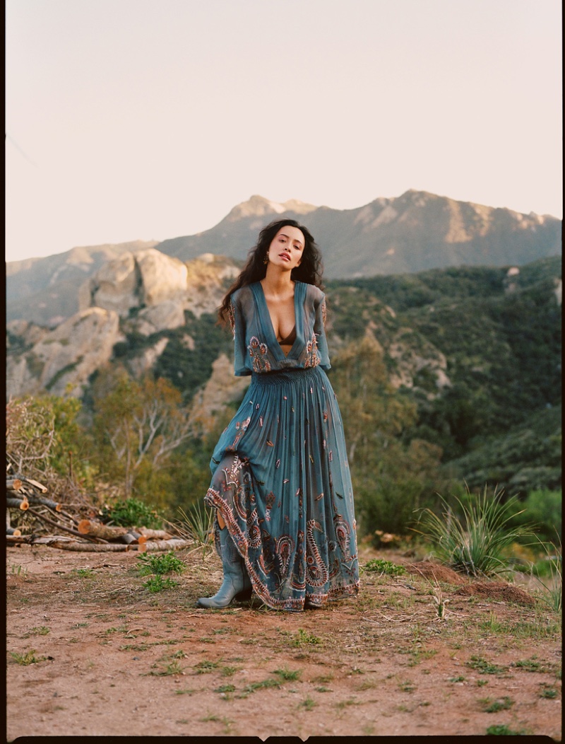 Actress Christian Serratos poses in an embellished blue maxi dress.