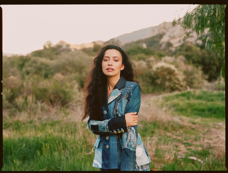 Clad in patchwork denim, Christian Serratos looks gorgeous.