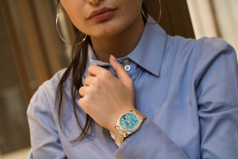 Cropped Woman Wearing Rolex Watch Gold