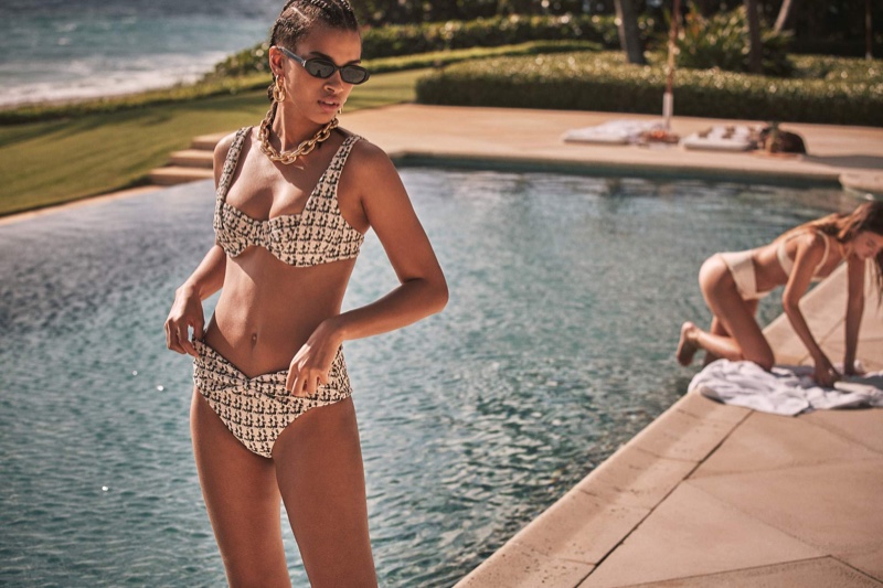 Posing poolside, Nisaa Pouncey fronts Devon Windsor Swim spring 2021 campaign.