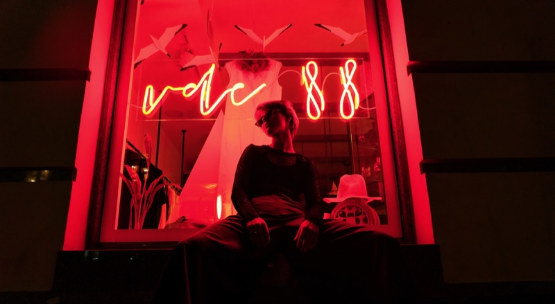 Gen Z Young Woman Posing Front Red Neon Lights