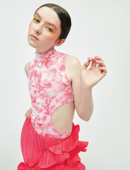 Lachlan Watson Takes the Spotlight for ELLE Mexico Dressed in pink, Lachlan Watson wears floral prints and ruffles.