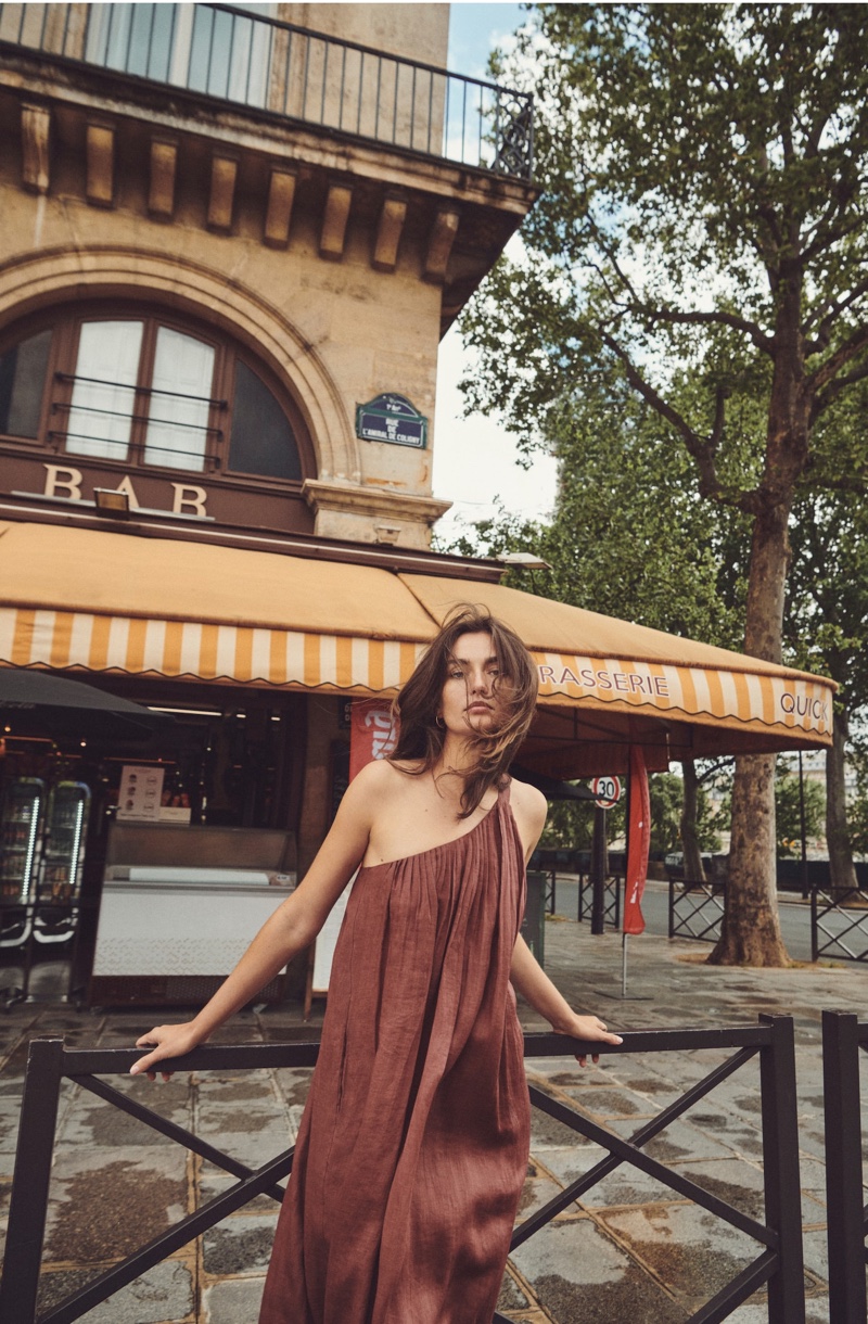 Andreea Diaconu poses in Massimo Dutti asymmetric dress.