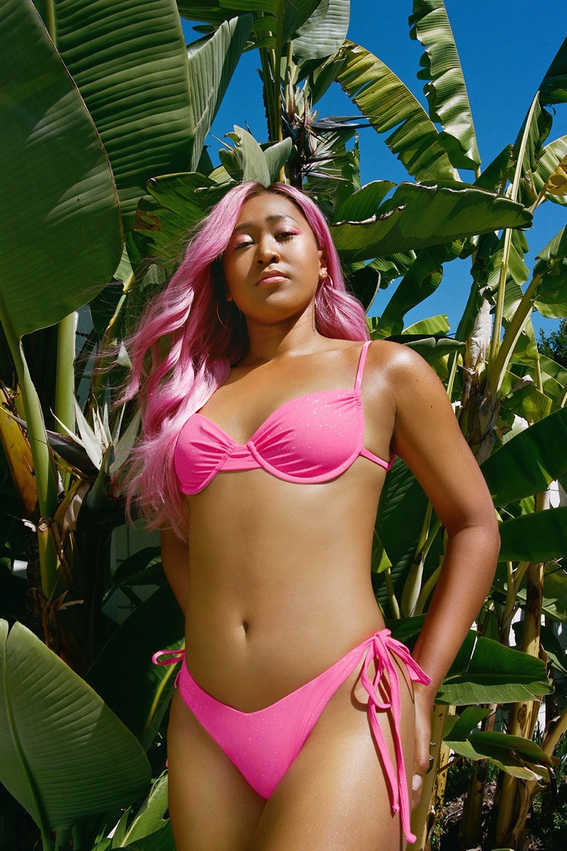 Wearing pink hair, Naomi Osaka poses in Frankies Bikinis collaboration.