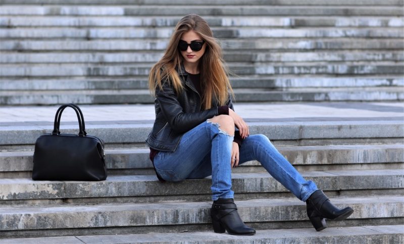 Woman in Jeans and Leather Jacket
