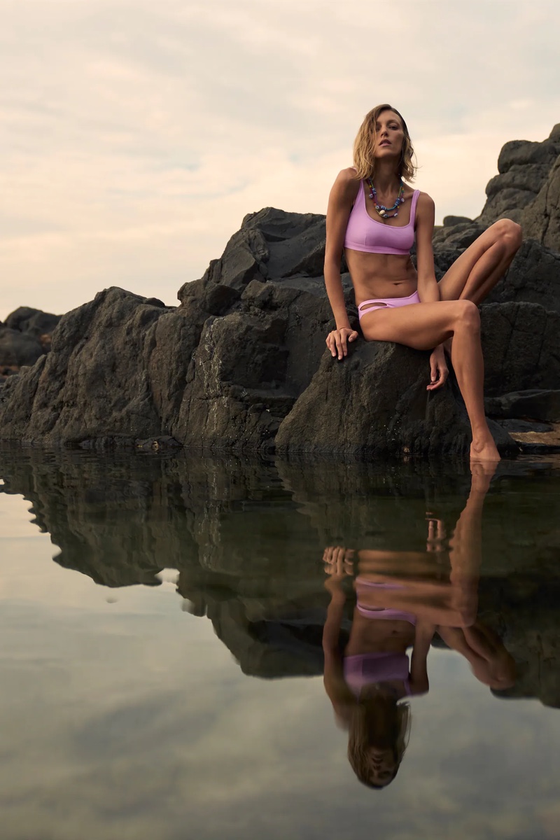 Model Anja Rubik poses in Zara Cut Out Bikini Top and Bikini Bottom.