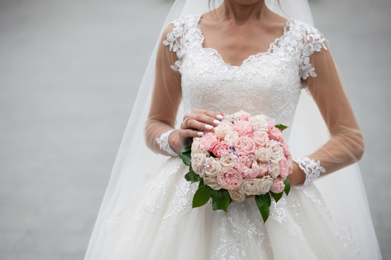 Cropped Bride Lace Detail Holding Flower Bouquet