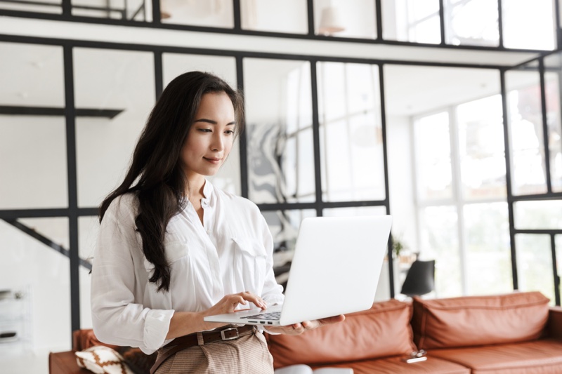 Fashionable Asian Woman Working Laptop