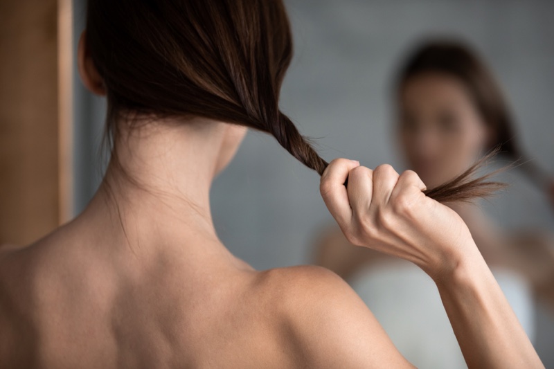 Female Woman Holding Thin Hair Mirror Back
