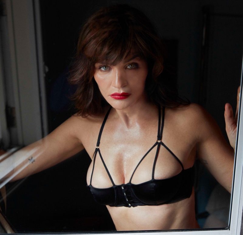 Wearing red lipstick, Helena Christensen fronts Coco de Mer Icons campaign.