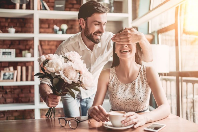 Man Giving Woman Flowers