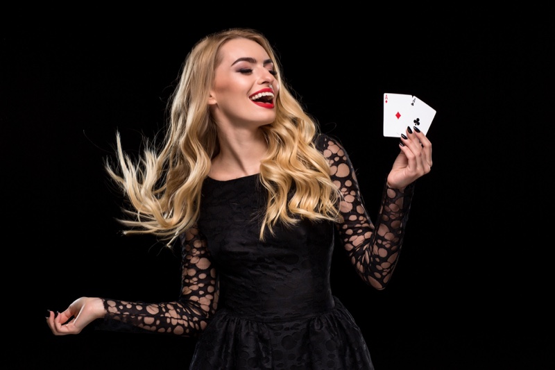 Smiling Blonde Woman Black Dress Two Ace Cards