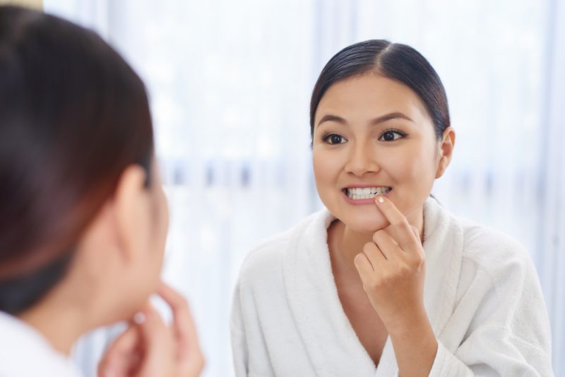 Woman Checking Teeth