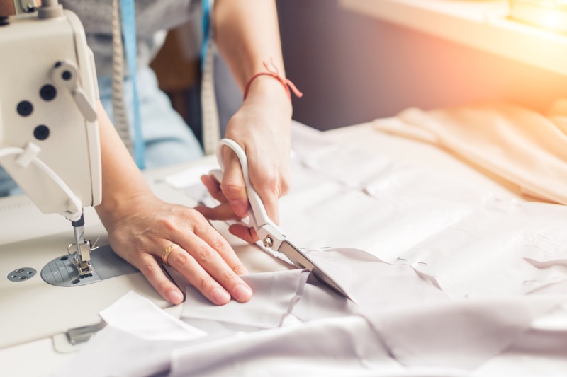Woman Cutting Fabric