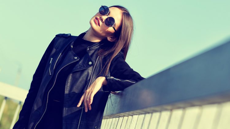 Woman Wearing Leather Jacket and Sunglasses