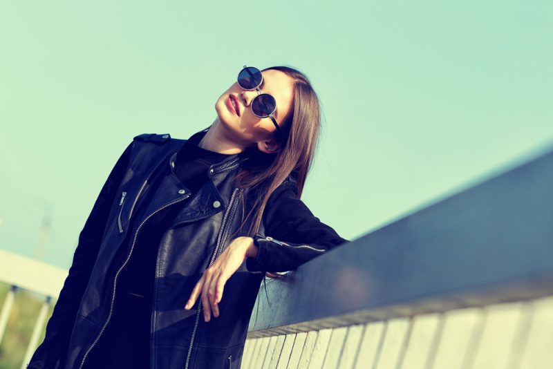 Woman Wearing Leather Jacket and Sunglasses