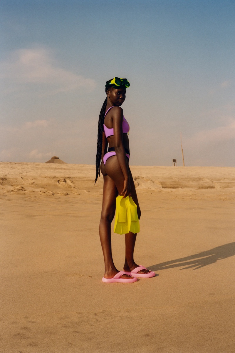 Adut Akech wears Zara Zip Bikini Top and Piped Bikini Bottom.