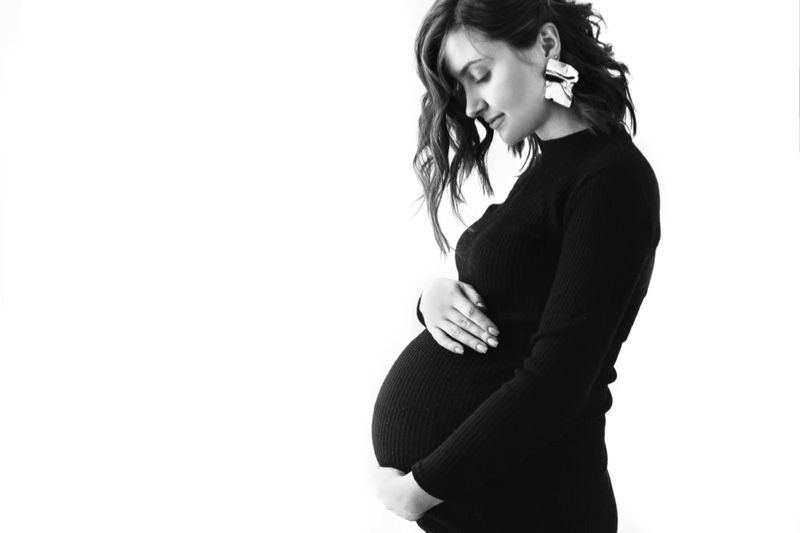 Beautiful Pregnant Woman Black Dress Holding Belly
