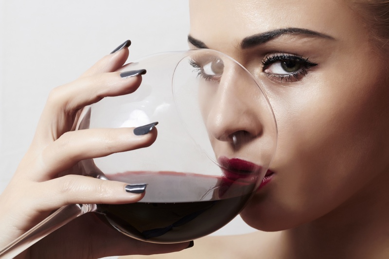Closeup Model Drinking Wine Glass