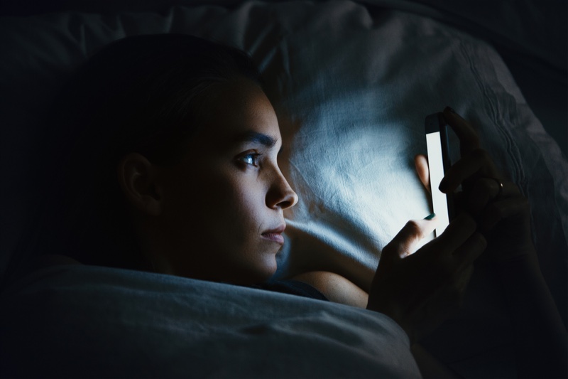 Closeup Woman Using Lit Phone Night Bed