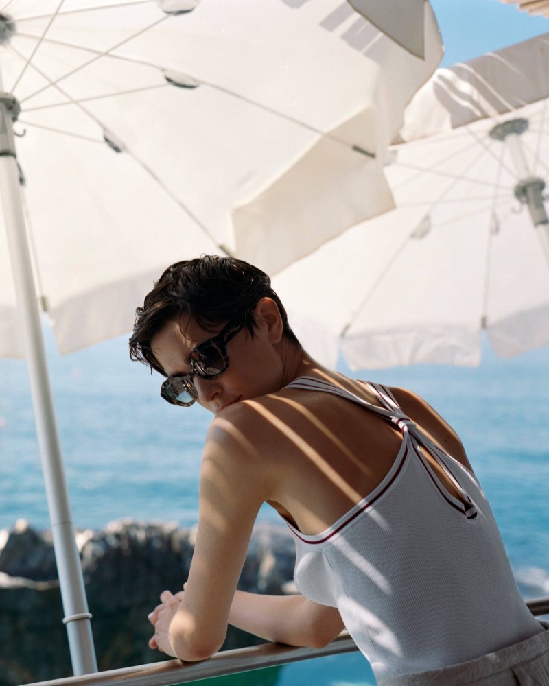 Wearing sunglasses and a knit top, Louise de Chevigny poses in Giorgio Armani summer 2021 campaign.