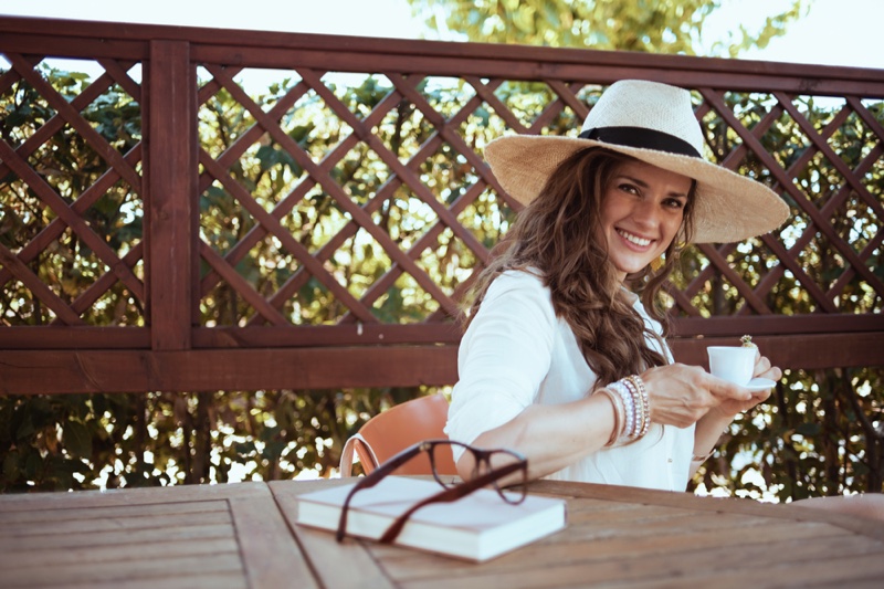 Happy Woman Straw Hat Coffee Cup Relaxed Cottage