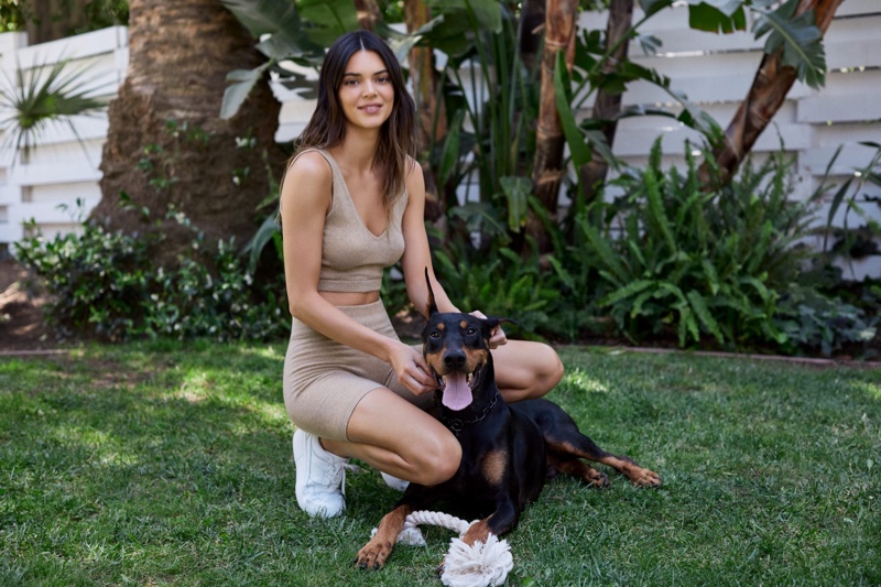 Kendall Jenner poses with her dog Pyro for About You collection.