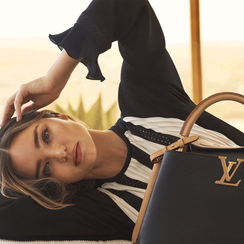 Getting her closeup, Miranda Kerr fronts Louis Vuitton Capucines 2021 handbag campaign.