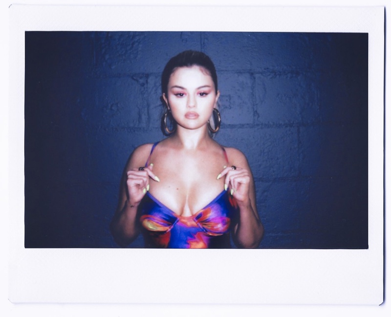 Posing for a polaroid, Selena Gomez wears her La'Mariette swimsuit collaboration.