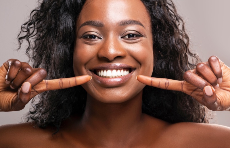 Smiling Black Woman Showing Healthy Teeth