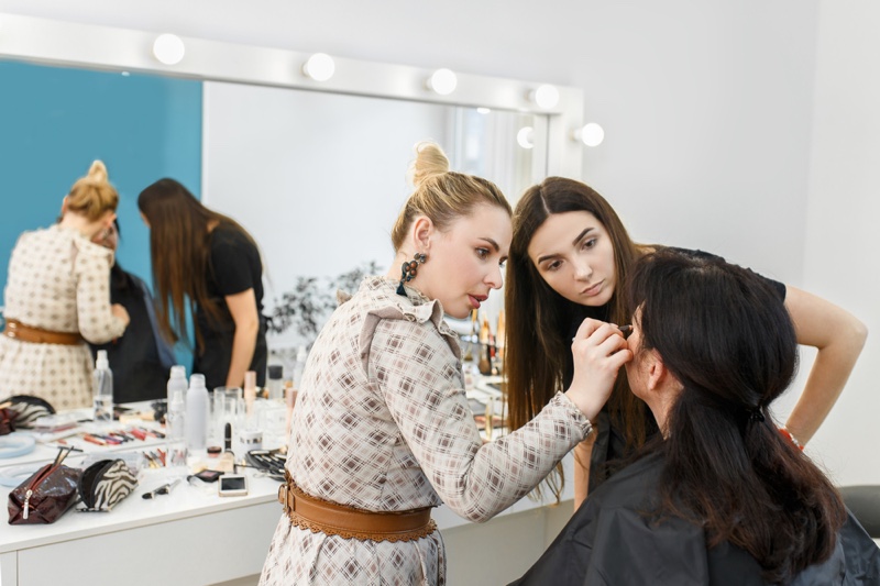 Teacher Showing Student Makeup Techniques