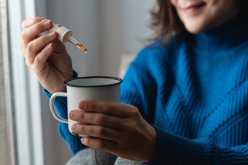Woman CBD Oil Dropper Cup