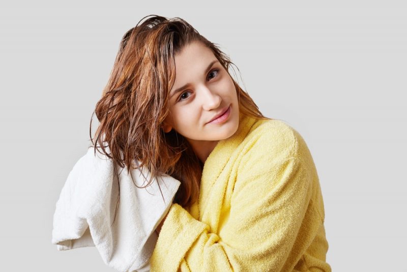 Woman Drying Hair with Towel