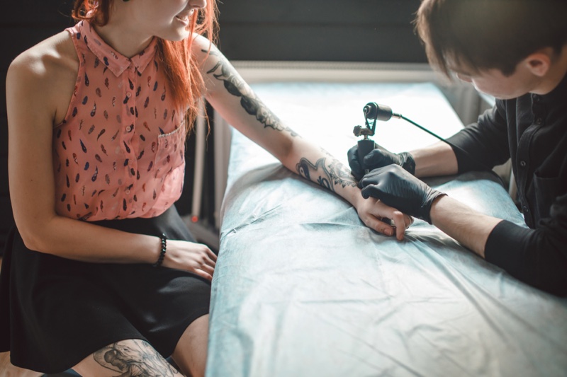 Woman Getting Tattoo Sitting