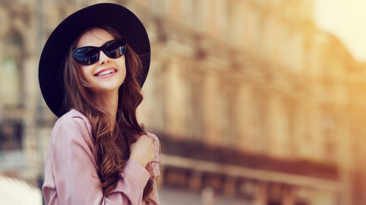 Woman Wearing Fedora and Sunglasses
