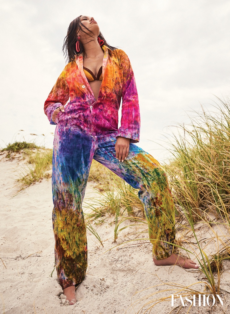 Rocking bold colors, Ashley Callingbull wears 4Kinship jumpsuit, Angela Demontigny bikini top, and Warren Steven Scott earrings. Photo: Gabor Jurina / 