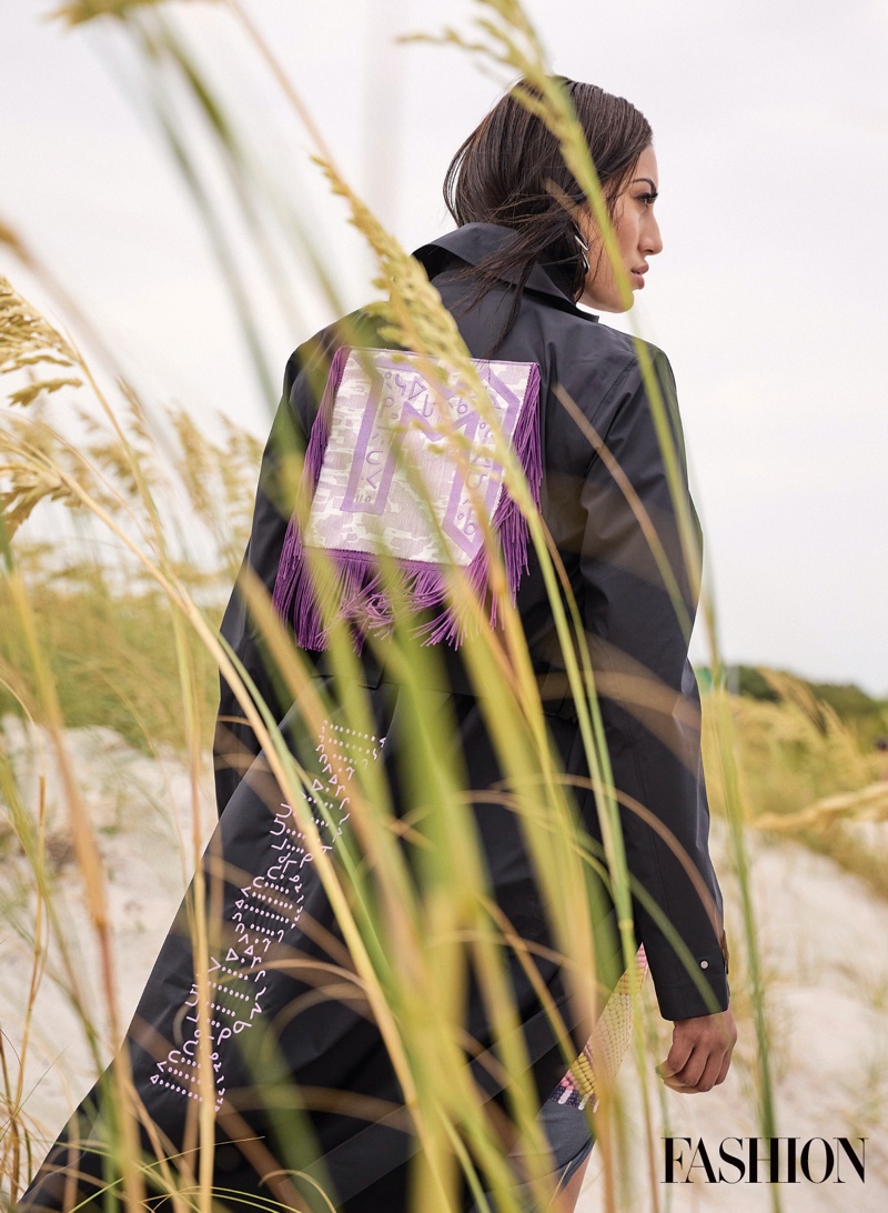 Ashley Callingbull poses in Mobilize jacket, Jambe Okuma dress, and Warren Steven Scott earrings. Photo: Gabor Jurina / FASHION