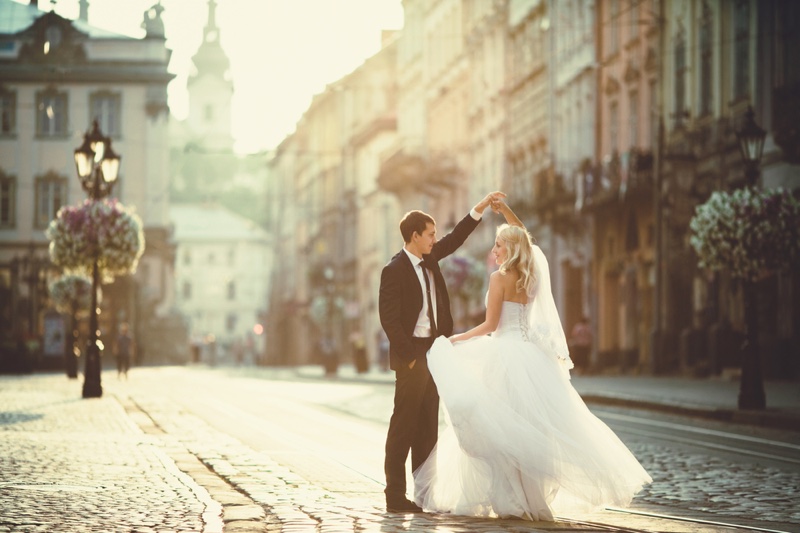 Bride Groom Cobblestone Streets Dancing Wedding Dress