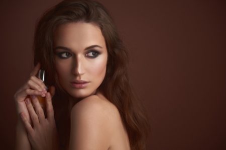 Why Perfume Should Always Be a Part of Your Outfit Brunette Model Fragrance Bottle Beauty