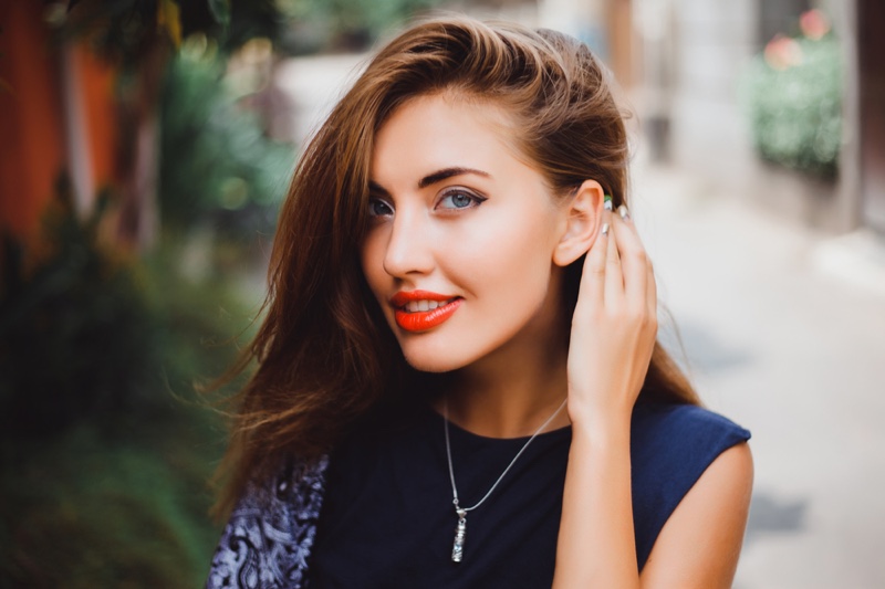 Closeup Woman Pendant Necklace Orange Lipstick